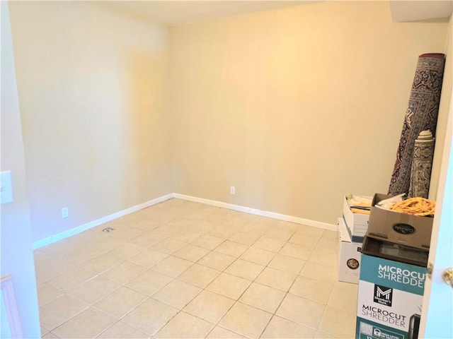 9800 W 147th St, Overland Park, KS 66221 - empty room featuring light tile patterned floors and baseboards