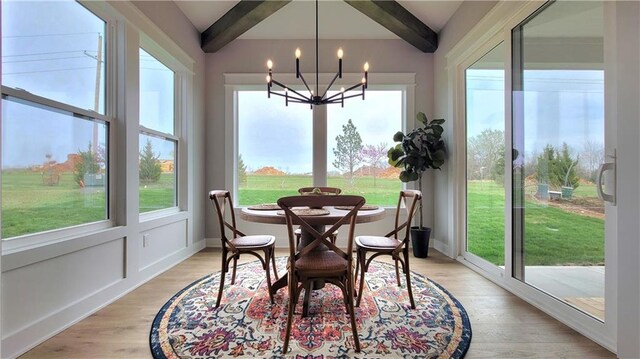 17148 S Heatherwood St, Olathe, KS 66062 - sunroom with a chandelier, healthy amount of natural light, and wood finished floors