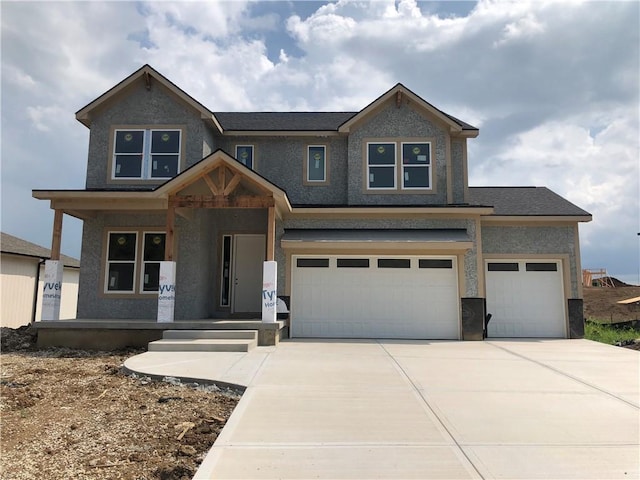17148 S Heatherwood St, Olathe, KS 66062 - view of front facade with driveway, an attached garage, covered porch, and stucco siding
