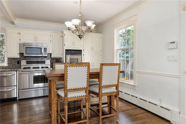 dining area with ornamental molding, dark wood finished floors, a notable chandelier, and a baseboard radiator