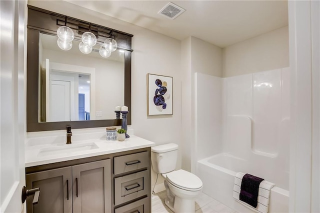 bathroom with toilet, visible vents, and vanity
