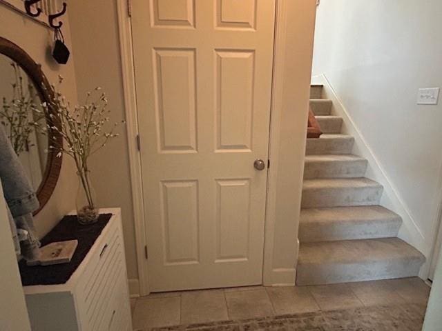 stairs featuring baseboards