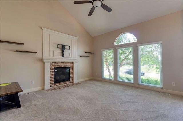 20534 W 199th Ter, Spring Hill, KS 66083 - unfurnished living room featuring carpet flooring, a ceiling fan, high vaulted ceiling, and a brick fireplace