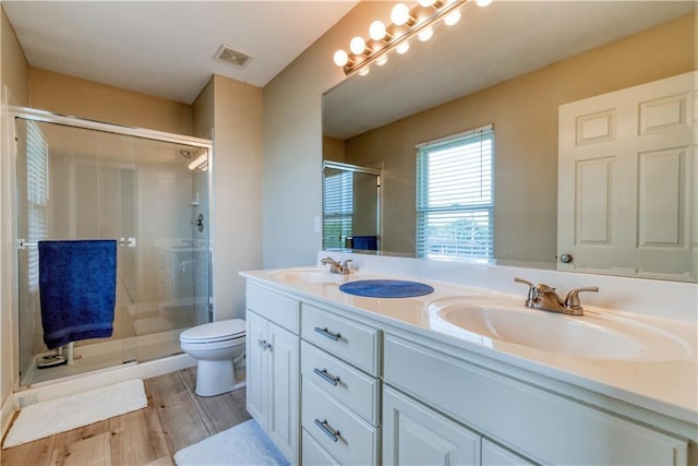 20534 W 199th Ter, Spring Hill, KS 66083 - full bath featuring a shower stall, double vanity, and wood finished floors