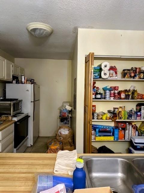 kitchen featuring a textured ceiling