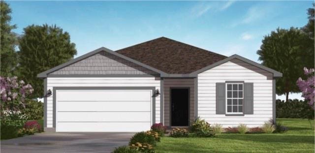 view of front of house with concrete driveway, a front lawn, and a garage