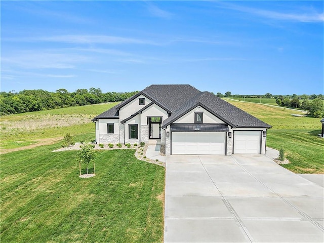 10075 NW Hillsboro Rd, Platte City, MO 64079 - modern farmhouse featuring stone siding, concrete driveway, a front yard, and an attached garage
