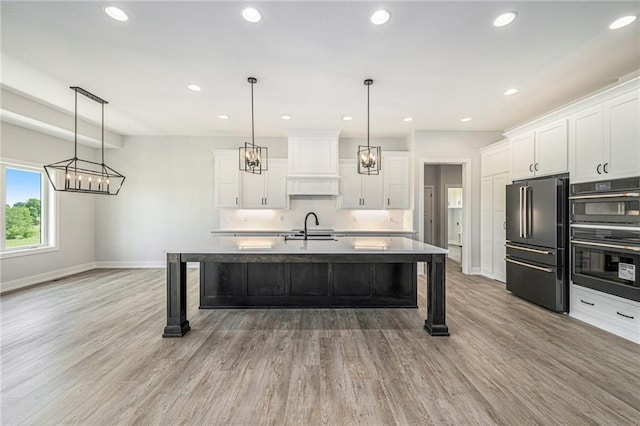 10075 NW Hillsboro Rd, Platte City, MO 64079 - kitchen featuring freestanding refrigerator, a chandelier, white cabinets, and recessed lighting