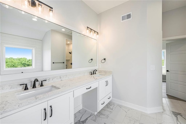 10075 NW Hillsboro Rd, Platte City, MO 64079 - full bathroom with marble look tiles, double vanity, and recessed lighting