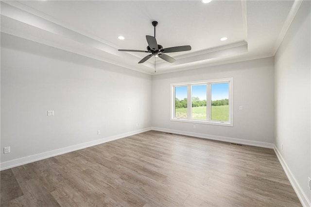 10075 NW Hillsboro Rd, Platte City, MO 64079 - unfurnished room with a raised ceiling, wood finished floors, recessed lighting, ceiling fan, and ornamental molding