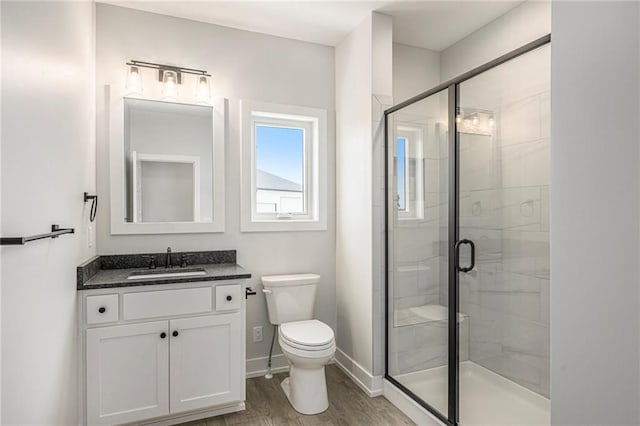 10075 NW Hillsboro Rd, Platte City, MO 64079 - full bath featuring vanity, a stall shower, and wood finished floors