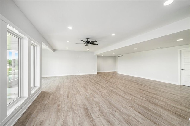 10075 NW Hillsboro Rd, Platte City, MO 64079 - unfurnished living room with light wood-type flooring, ceiling fan, and recessed lighting