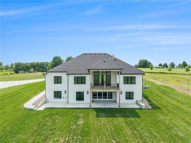 10075 NW Hillsboro Rd, Platte City, MO 64079 - rear view of house featuring a patio area, a balcony, a yard, and a shingled roof