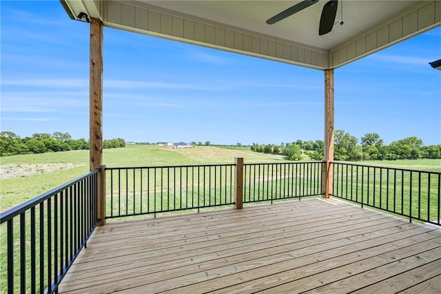 10075 NW Hillsboro Rd, Platte City, MO 64079 - deck with a ceiling fan, a view of countryside, and a lawn