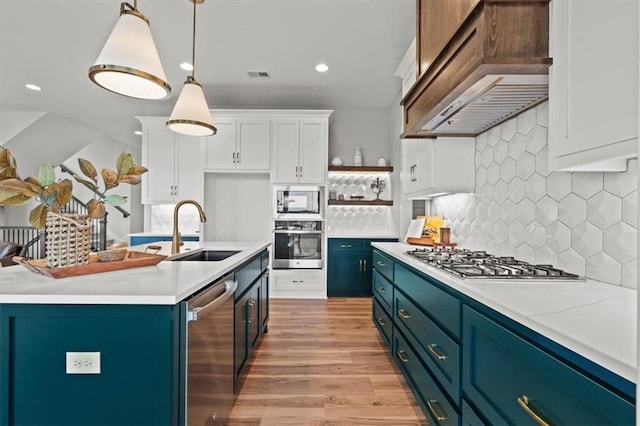 17163 S Laurelwood St, Olathe, KS 66062 - kitchen featuring appliances with stainless steel finishes, exhaust hood, open shelves, white cabinets, and light countertops