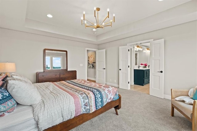 17163 S Laurelwood St, Olathe, KS 66062 - bedroom featuring a chandelier, light colored carpet, baseboards, a raised ceiling, and ensuite bath