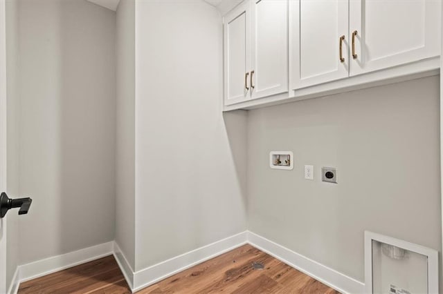 17163 S Laurelwood St, Olathe, KS 66062 - laundry room featuring electric dryer hookup, cabinet space, washer hookup, baseboards, and light wood-style flooring
