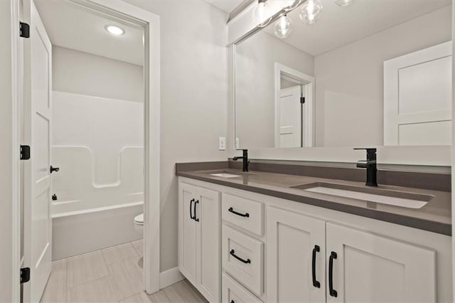 17163 S Laurelwood St, Olathe, KS 66062 - bathroom with double vanity and bathing tub / shower combination