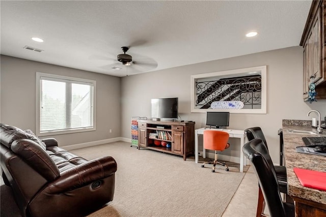 living area featuring light carpet, a ceiling fan, baseboards, recessed lighting, and visible vents