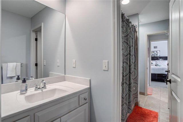 full bath featuring vanity, a shower with shower curtain, and tile patterned floors