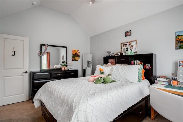bedroom featuring carpet floors and vaulted ceiling
