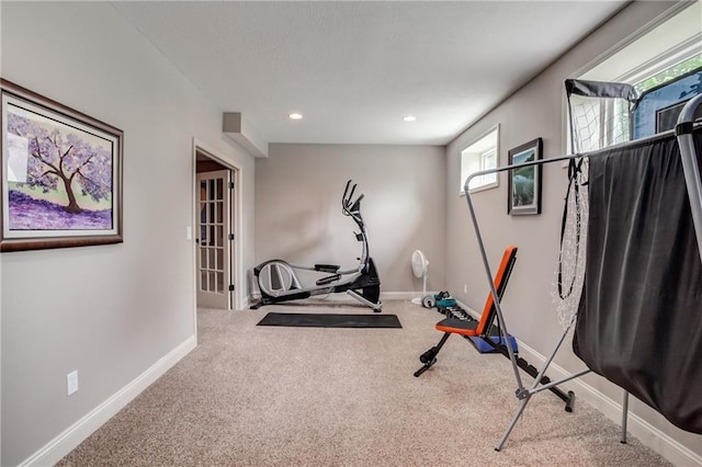 exercise room featuring baseboards, carpet flooring, and recessed lighting