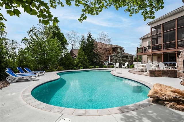 outdoor pool featuring a patio