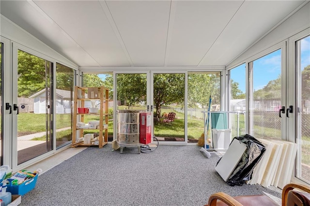 unfurnished sunroom with vaulted ceiling and french doors