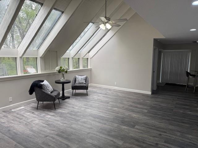 living area featuring recessed lighting, wood finished floors, vaulted ceiling, ceiling fan, and baseboards