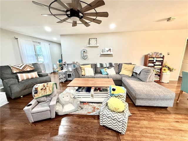 living room featuring ceiling fan and wood finished floors
