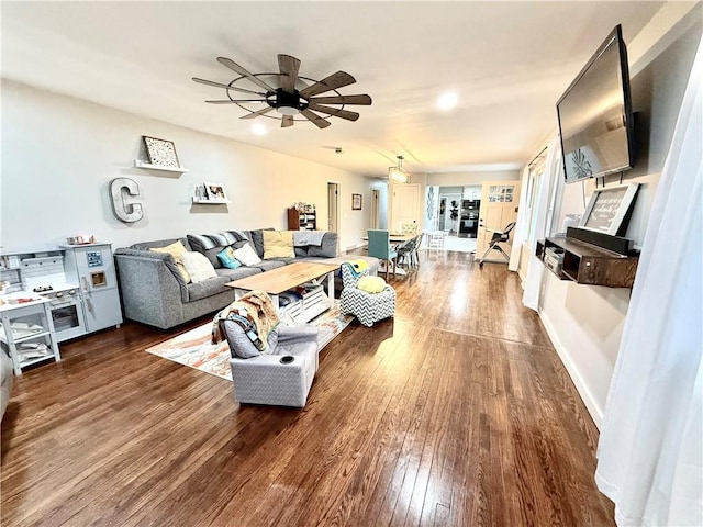 living area featuring recessed lighting, a ceiling fan, and dark wood-style floors