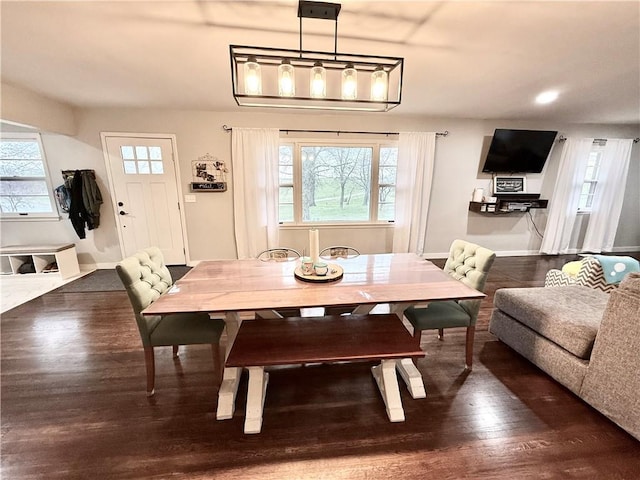 dining area featuring recessed lighting, baseboards, and wood finished floors