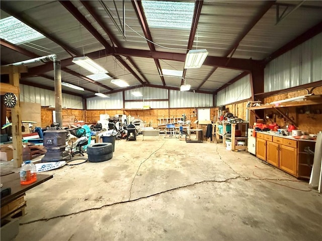 garage with metal wall and a workshop area