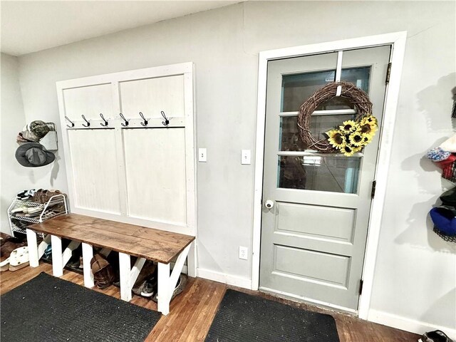 mudroom featuring baseboards and wood finished floors
