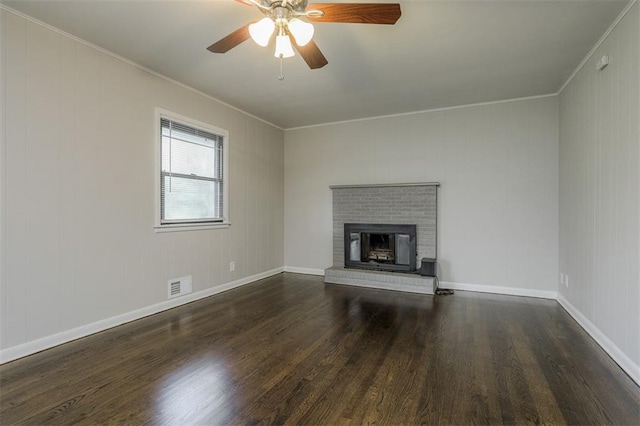 unfurnished living room featuring wood finished floors, visible vents, and ornamental molding