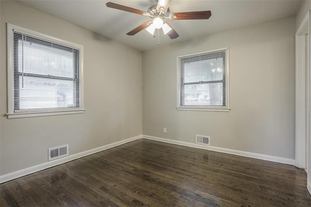 empty room with baseboards, visible vents, and plenty of natural light