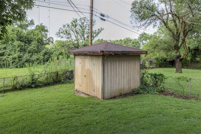 view of shed featuring a fenced backyard