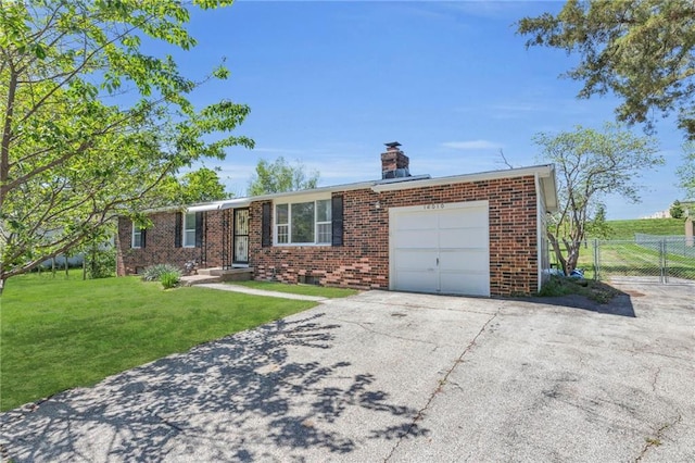 ranch-style home featuring brick siding, a garage, a front lawn, and fence