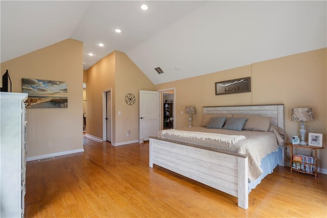 bedroom featuring visible vents, vaulted ceiling, light wood-type flooring, baseboards, and recessed lighting