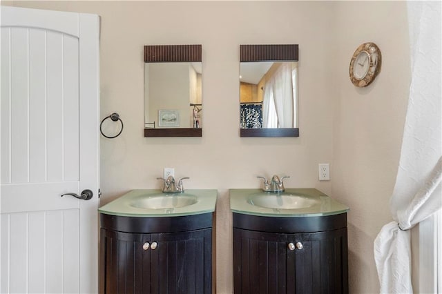bathroom with a sink and two vanities