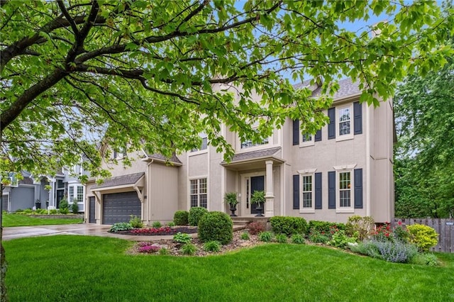 view of front of property featuring concrete driveway, an attached garage, and stucco siding