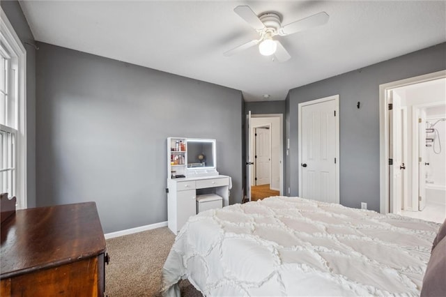 bedroom with baseboards, carpet, a ceiling fan, and a closet