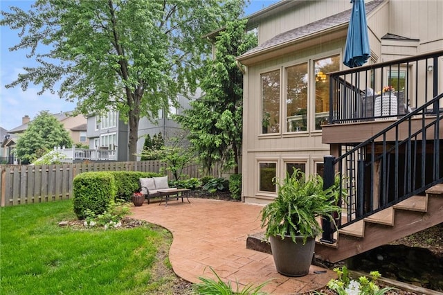 view of yard with stairway, a patio, and an outdoor hangout area