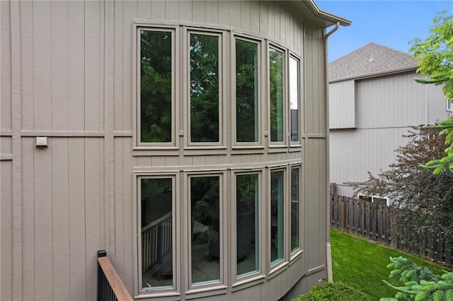 view of home's exterior featuring fence