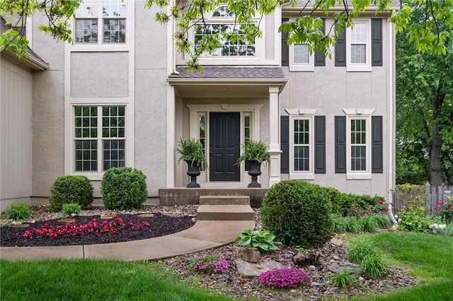 doorway to property with stucco siding