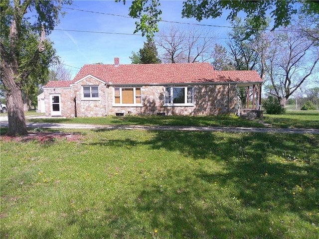 single story home featuring a chimney and a front lawn