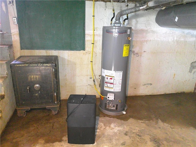 utility room featuring water heater