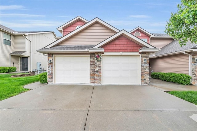 15443 NW 124th St, Platte City, MO 64079 - craftsman house with driveway, a garage, and stone siding