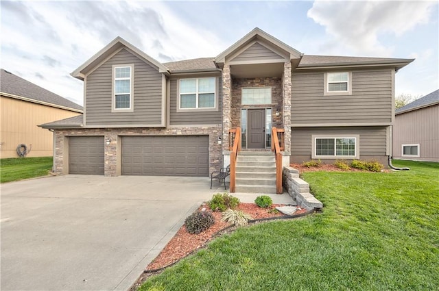 bi-level home with a garage, a front lawn, stone siding, and concrete driveway