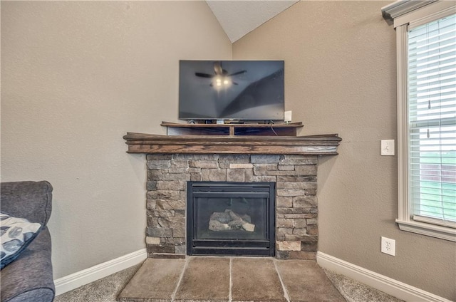 room details with carpet floors, baseboards, and a fireplace